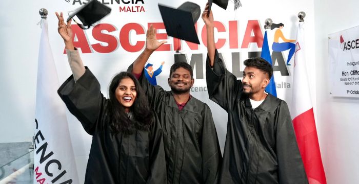 International graduates celebrating Graduation Day at Ascencia Malta with caps in the air